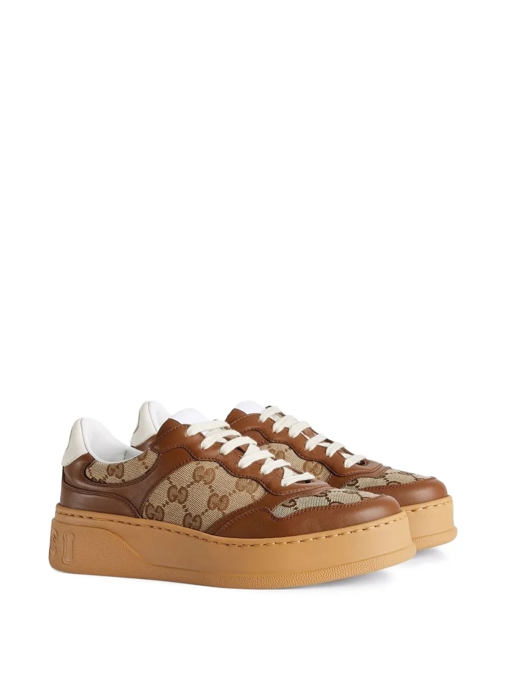 Gucci GG embossed low-top sneakers angle view